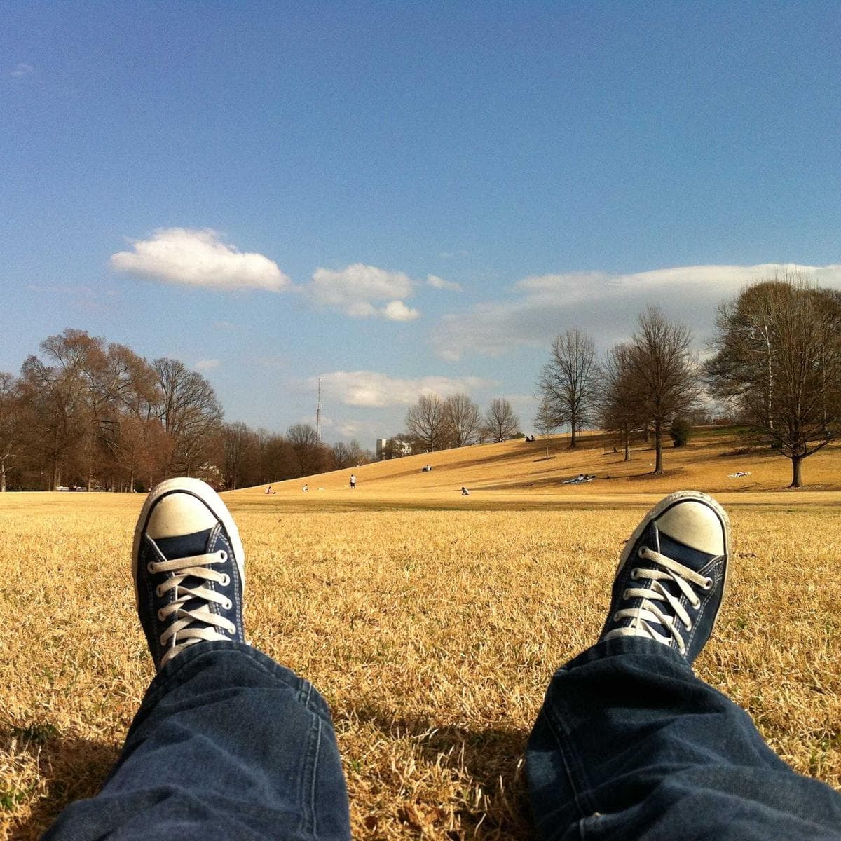 Feet up on the grass in the park